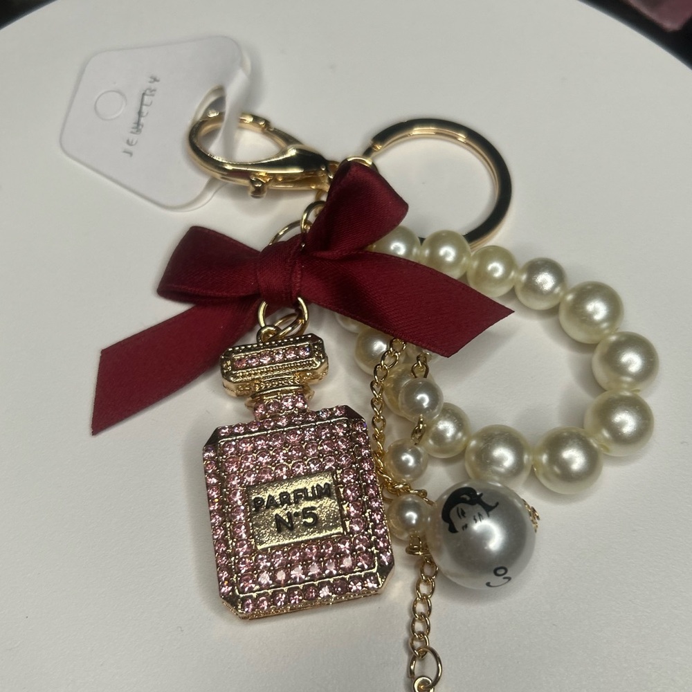 Parfum rhinestone key chain , bag charm pink with ribbon and pearls new